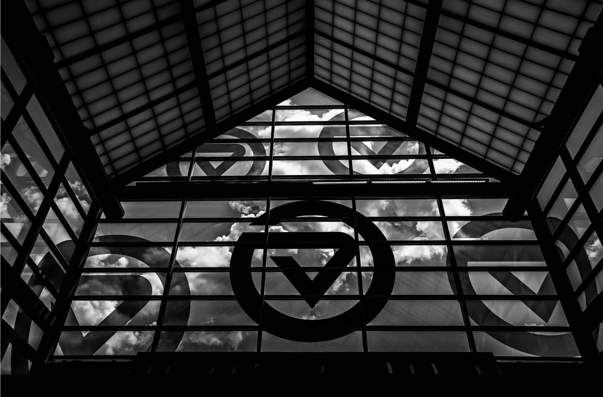 black and white photo of inside of Kirkhof Center skylight with circle GVs